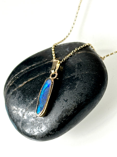 9 Carat Gold Solid Black Opal Pendant Necklace showcasing a deep blue opal with neon flashes on a black stone.