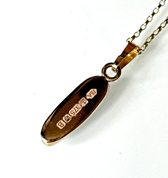 9 carat gold pendant with markings, part of a Black Opal pendant necklace featuring stunning opal.